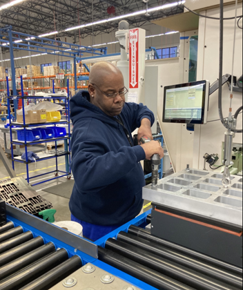 Man finalizing a battery in the manufacturing process